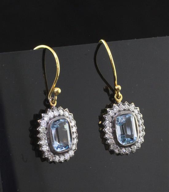 A pair of gold, blue topaz and diamond set cluster earrings, 0.5in.